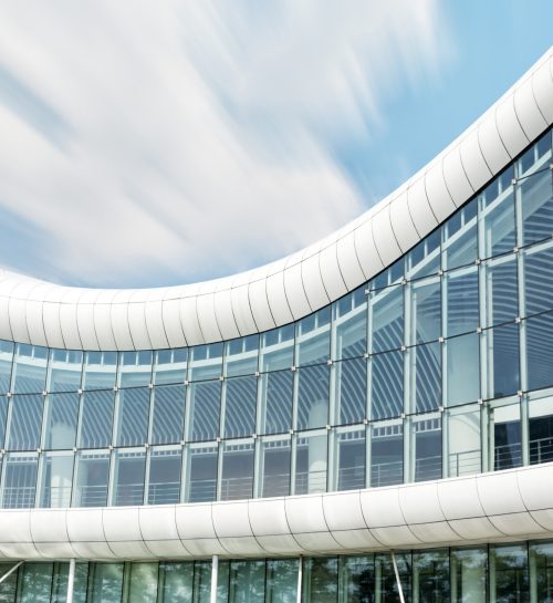 Modern glass silhouettes on modern building.