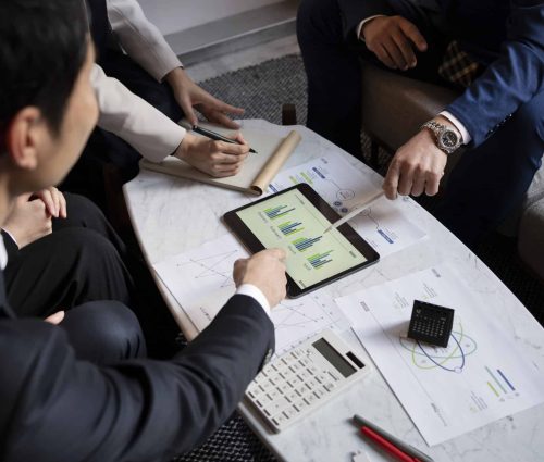 business-people-working-with-ipad-high-angle