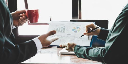 Business team analyzing income charts and graphs. Close up. Business analysis and strategy concept.