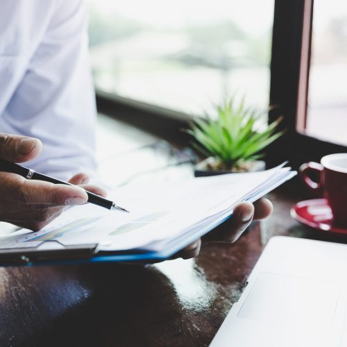 Businessman analysis working discussing the charts and graphs showing the results.