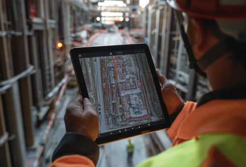 construction-team-meeting-engineers-project-managers-collaborating-industrial-site-planning