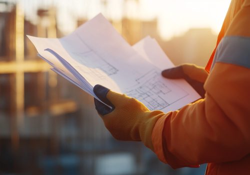 person-is-holding-pen-writing-piece-paper