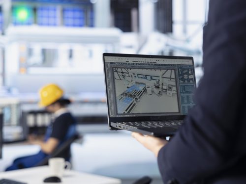 Photovoltaics factory technician using laptop to do performance testing of solar panel designs. Employee improving existing solar panel configurations for cost reduction using notebook, close up