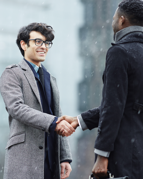 two-business-people-meeting-street (1)